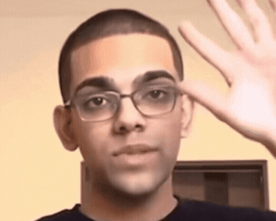 Young Man In Glasses Waving GIF