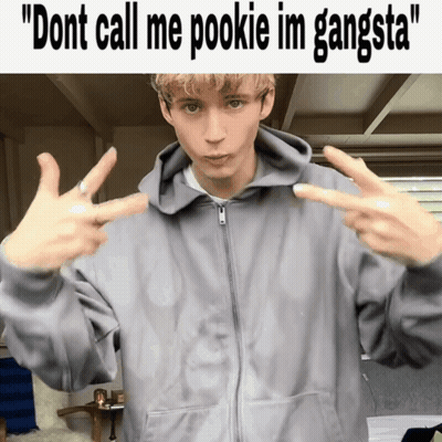 Young Man In Gray Hoodie Making Peace Sign GIF