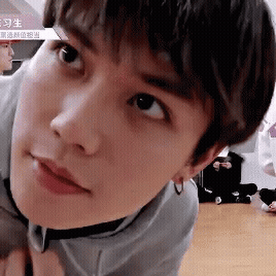 Young Man In Gray Shirt Close Up GIF