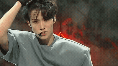 Young Man In Gray Shirt With Microphone GIF