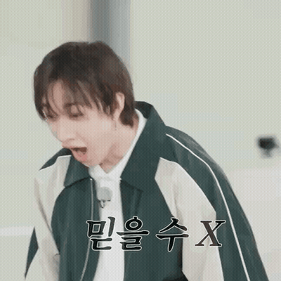 Young Man In Green And White Jacket Making Funny Face GIF