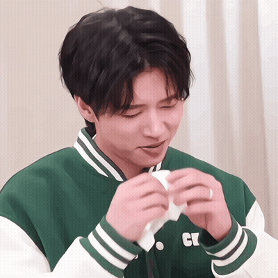 Young Man In Green And White Jacket With Letter C GIF