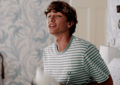 Young Man in Green and White Striped Shirt With BFF on Back