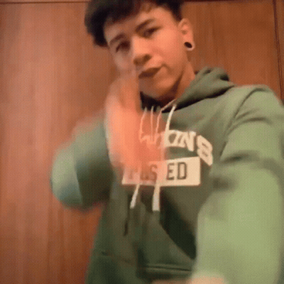 Young Man In Green Hoodie Saying Ed Taking Selfie GIF