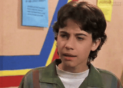 Young Man In Green Jacket With Blue And Yellow Stripe GIF
