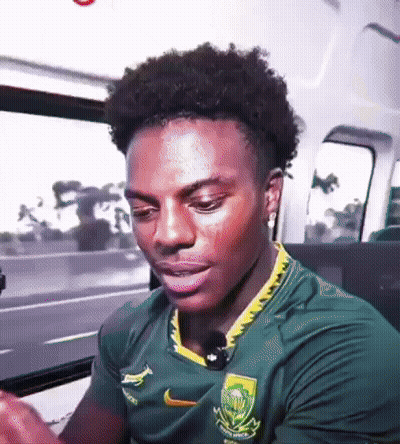Young Man In Green Nike Shirt Sitting In Car GIF