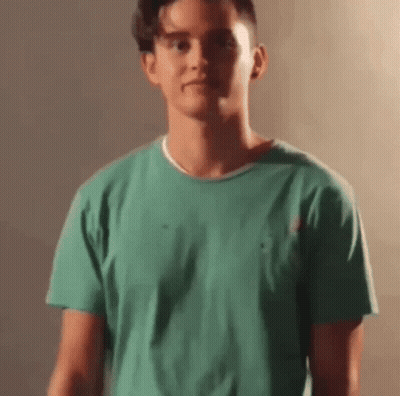 Young Man In Green Shirt GIF