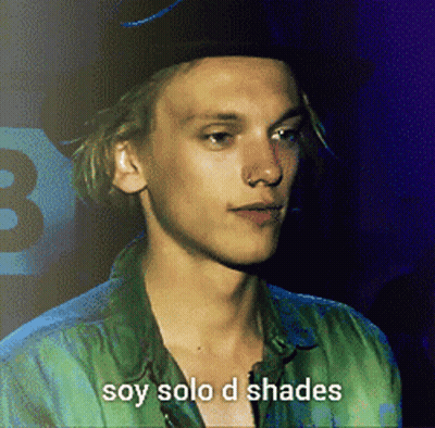 Young Man In Green Shirt And Black Hat Soy Solo D Shades GIF