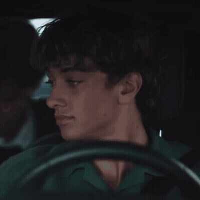 Young Man In Green Shirt Driving Car GIF