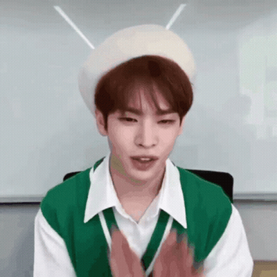 Young Man In Green Vest And White Beret Clapping GIF