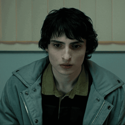 Young Man In Grey Jacket And Black Shirt GIF