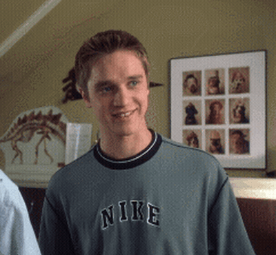 Young Man In Grey Nike Sweatshirt Smiling GIF