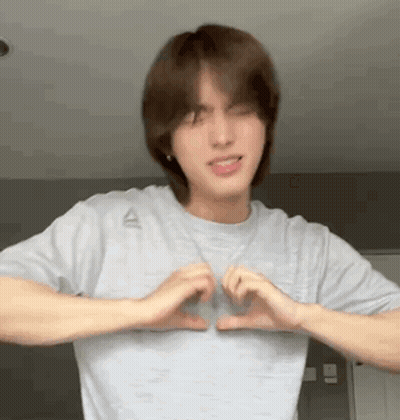 Young Man In Grey Shirt Making Heart With Hands GIF