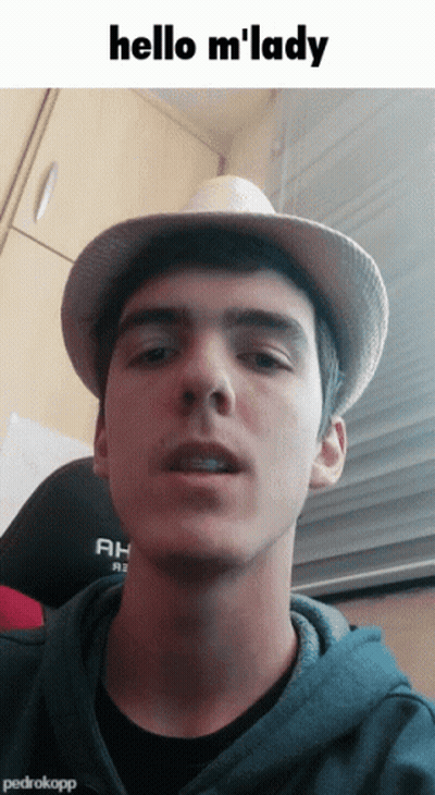 Young Man In Hat And Hoodie Says Hello M Lady GIF