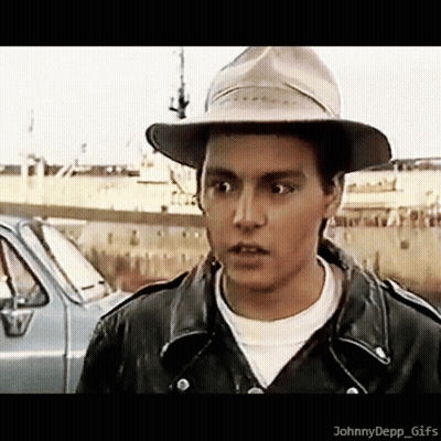 Young Man In Hat And Leather Jacket By Car GIF