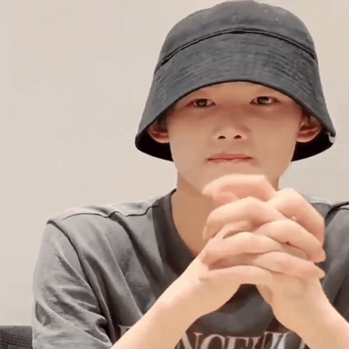 Young Man In Hat And T-Shirt With Word North GIF