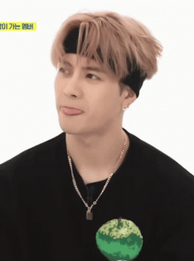 Young Man In Headband And Necklace Making Funny Face GIF
