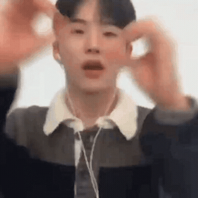 Young Man In Headphones And Jacket Making Funny Face GIF