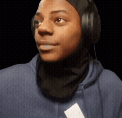 Young Man In Headphones And Scarf Making Funny Face GIF