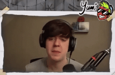 Young Man In Headphones And Sunglasses At Microphone GIF