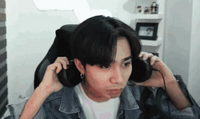 Young Man In Headphones Making Funny Face GIF