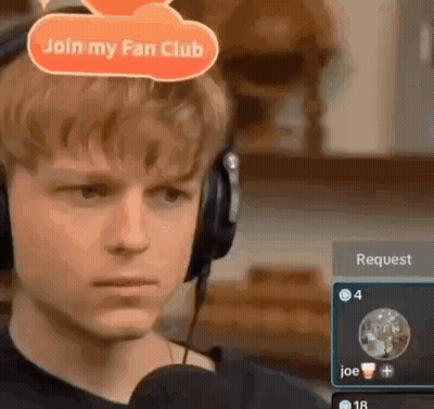 Young Man In Headphones Talking Into Microphone With Join My Fan Club Sign GIF