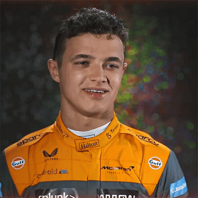 Young Man In Hilton Racing Suit Smiling GIF