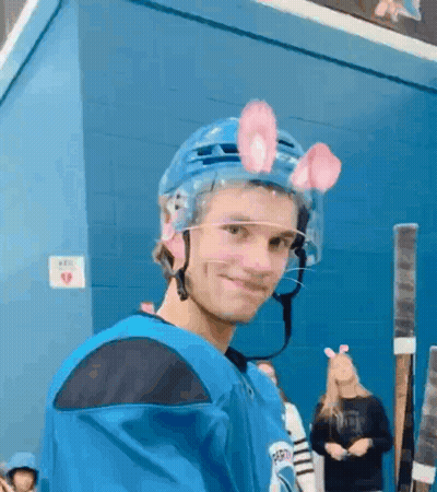 Young Man In Hockey Helmet With Bunny Ears GIF
