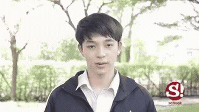 Young Man In Jacket And White Shirt In Park GIF