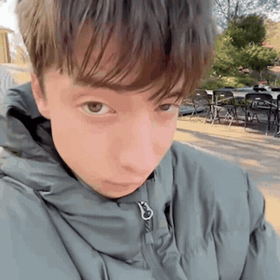 Young Man In Jacket Close Up GIF