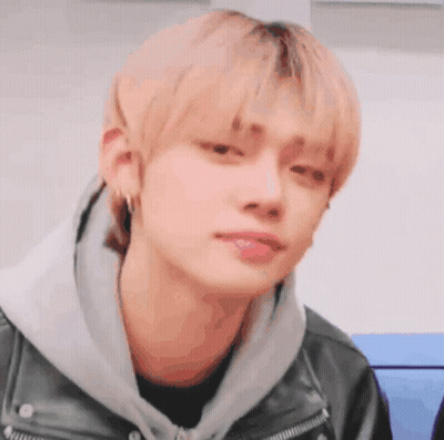 Young Man In Leather Jacket And Hoodie GIF