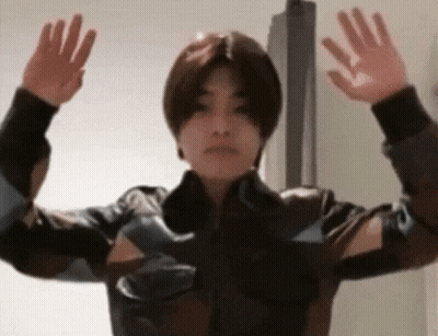 Young Man In Leather Jacket Arms Outstretched GIF