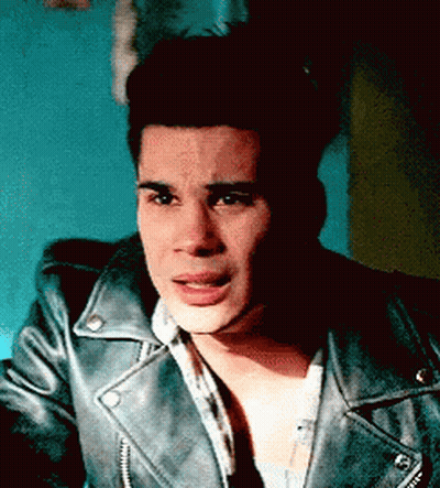 Young Man In Leather Jacket Making Funny Face GIF