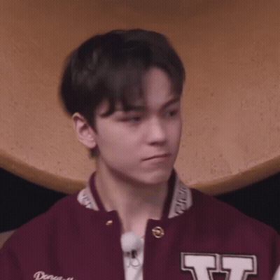 Young Man In Maroon Varsity Jacket And White Shirt GIF