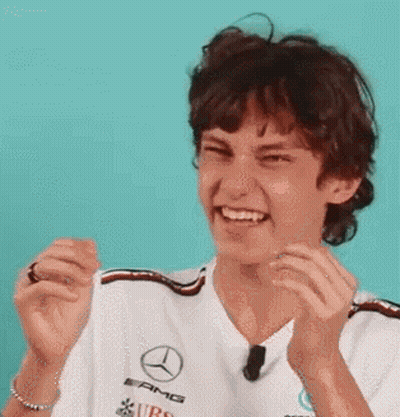 Young Man In Mercedes Shirt Laughing Clapping GIF