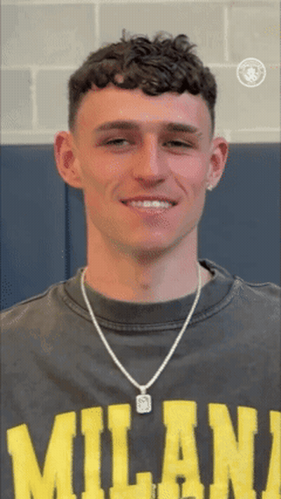 Young Man In Milan T-Shirt And Necklace Smiling GIF