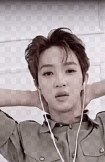 Young Man In Military Uniform With Headphones GIF