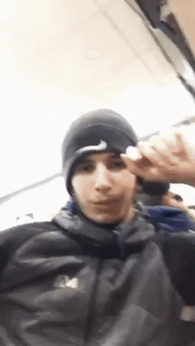 Young Man In Nike Hat And North Face Jacket GIF