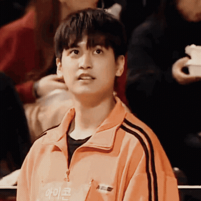 Young Man In Orange Jacket Saying A GIF