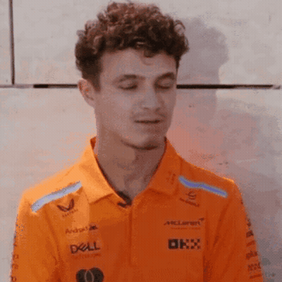 Young Man In Orange Polo With Dell Logo GIF