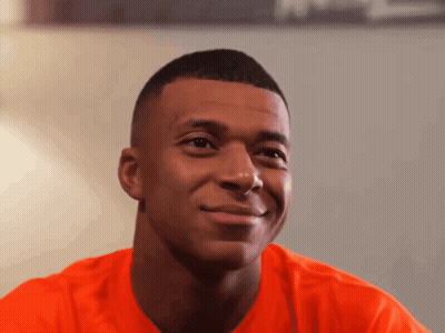 Young Man In Orange Shirt Smiling GIF