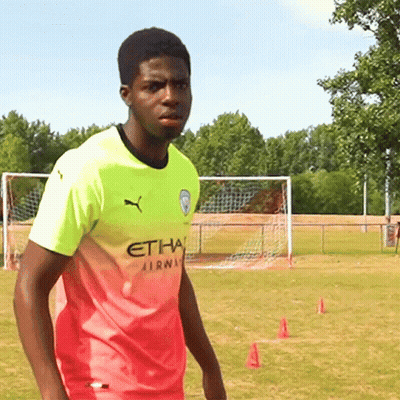 Young Man In Pink And Yellow Etihad Airways Shirt GIF