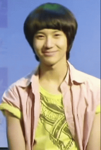 Young Man In Pink And Yellow Shirts Smiling GIF