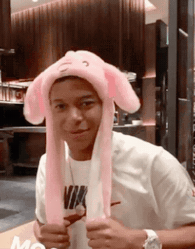 Young Man In Pink Bunny Hat And White Nike Shirt GIF