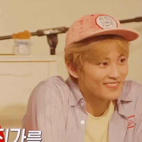Young Man In Pink Hat With Letter S Smiling GIF