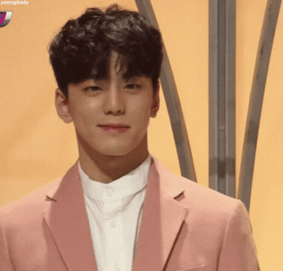 Young Man In Pink Jacket Smiling GIF