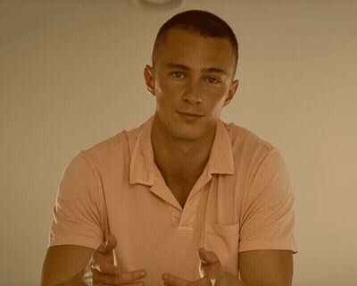 Young Man In Pink Polo Shirt With Folded Hands GIF