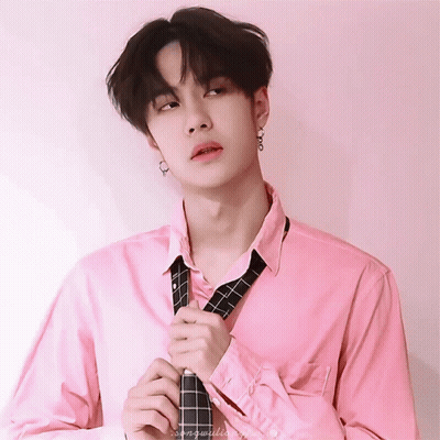 Young Man In Pink Shirt Adjusting Tie GIF