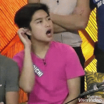 Young Man in Pink Shirt Making Funny Face