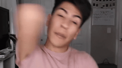 Young Man In Pink T-Shirt Making Funny Face GIF